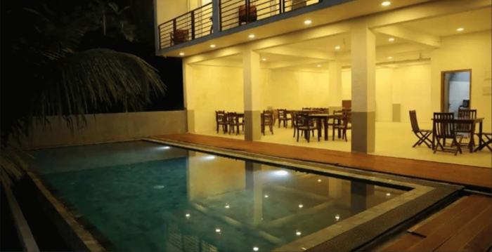 The villa pool at night